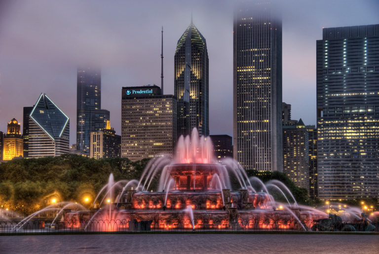 Buckingham Fountain (lit red) in Chicago (Grant Park). I wanted to shoot at night because I find it far more interesting lit up in darkness, as well as being in the shadow of the loop's vast array of unique skyscrapers.  To avoid the crowds, I went at night in the cold and rain.  Modeled after Latona Fountain at Versailles by Jacques Lambert and statues by Marcel F. Loyau.